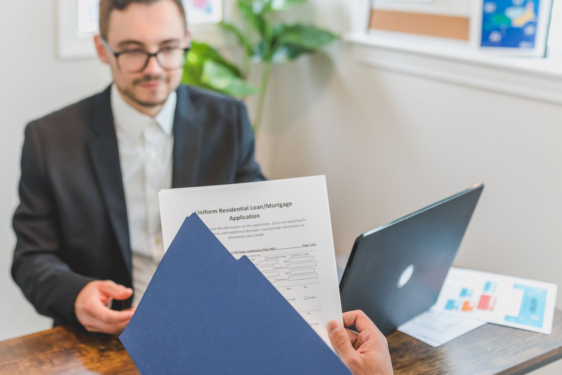 Student loan documents with coffee cup